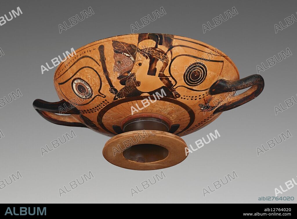 VILLA GIULIA PAINTER and NIKOSTHENES. Wine Cup with Herakles and Athena.     Additional Info: A pair of large eyes frames busts of the hero Herakles and his patron goddess Athena on one side of this black-figure cup. In the 500s BC, Greek vase-painters frequently placed eyes on cups, perhaps because they were believed to be apotropaic--that is, they had the power to ward off evil -- or so that the cup would be transformed into a mask when a drinker raised it to his lips . Above the left eyebrow runs the signature of the potter Nikosthenes. The other side of the cup has a similar scene with three busts, two female and one male. The female figure in the middle was once painted white and wears a type of headdress called a polos, typical of Greek goddesses. These busts, however, are harder to identify than those on the front of the cup. Some scholars identify them as Zeus, Hebe, and Hera, suggesting that the subject of the cup as a whole would be the apotheosis of Herakles, his introduction on Mount Olympus as a god. Others, however, interpret the heads as Hades, Persephone, and Demeter and the cup's theme as Herakles' introduction into the Eleusinian Mysteries, a cult that promised a better afterlife to its followers.