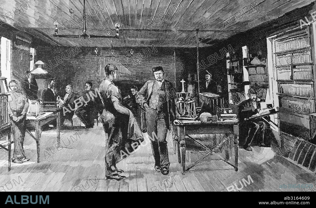 Thomas Alva Edison 1847-1931, centre, in his laboratory at Menlo Park.