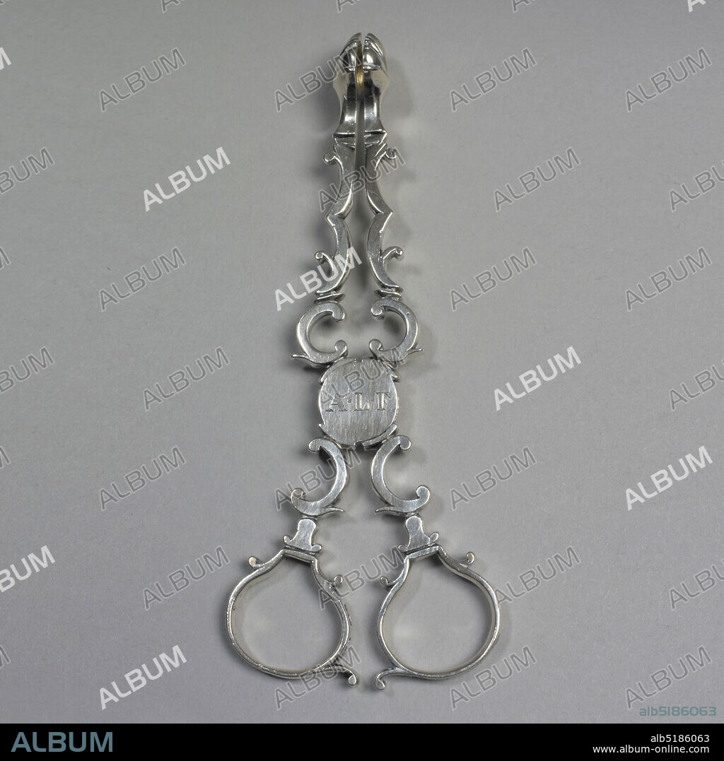 Sugar Tongs, silver, Scissors-type nippers, the arm composed of interlocking scrolls, terminating in shell-shaped ends. Circular swing-joint at center; engraved. Scroll handles with shaped finger loops., London, England, ca. 1760, metalwork, Decorative Arts.