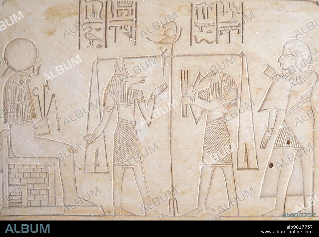 Alabaster plaque depicting the weighing of souls by Anubis the Ancient Egyptian God of the afterlife.