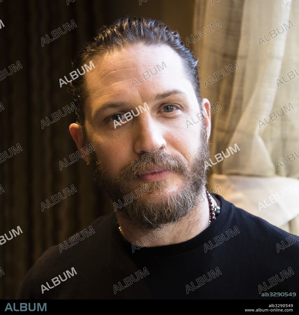 TOM HARDY. January 11, 2017 - Hollywood, California, U.S. - TOM HARDY promotes TV series on FX 'Taboo.' Edward Thomas Tom Hardy (born 15 September 1977) is an English actor and producer. He made his debut in Ridley Scott's 2001 action film Black Hawk Down. Hardy's other notable films include the science fiction film Star Trek: Nemesis (2002), the crime film RocknRolla (2008), biographical psychological drama Bronson (2008), science fiction thriller Inception (2010), sports drama Warrior (2011), Cold War espionage film Tinker Tailor Soldier Spy (2011), crime drama Lawless (2012), drama Locke (2013), mobster film The Drop (2014), and the biographical western thriller The Revenant (2015), for which he received an Academy Award nomination for Best Supporting Actor. He also portrayed Bane in the superhero film The Dark Knight Rises (2012), Mad Max Rockatansky in the post-apocalyptic film Mad Max: Fury Road (2015), and both Kray twins in the crime thriller Legend (2015). Hardy's television roles include the HBO war drama miniseries Band of Brothers (2001), the BBC historical drama miniseries The Virgin Queen (2005), ITV's Wuthering Heights (2008), the Sky 1 drama series The Take (2009), and the BBC historical crime drama television series Peaky Blinders (2013). Upcoming: Star Wars: Episode VIII (2017), Dunkirk (2017), Fonzo (2017), Mad Max: The Wasteland (announced), Triple Frontier, Taboo (TV Series 2017. 11/01/2017