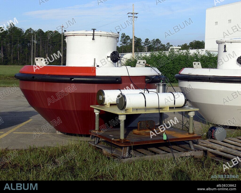 A NOAA tsunami buoy, DART surface buoy with pressure sensor. The DART system provides real-time tsunami detection as waves travel across an ocean basin. The stations consist of a bottom pressure sensor that is anchored to the seafloor and a companion moored surface buoy. Stennis Space Center, Mississippi, 2006. DART II became operational in 2005. A significant capability of DART II is the two-way communications between the BPR and the TWCs/NDBC using the Iridium commercial satellite communications system. The two-way communications allow the TWCs to set stations in event mode in anticipation of possible tsunamis or retrieve the high-resolution (15-s intervals) data in one-hour blocks for detailed analysis. DART II systems transmit standard mode data, containing twenty-four estimated sea-level height observations at 15-minute intervals, once very six hours. The two-way communications allow for real-time troubleshooting and diagnostics of the systems. The DART buoys have two independent and redundant communications systems. NDBC distributes the data from both transmitters under separate transmitter identifiers. NDBC receives the data from the DART II systems, formats the data into bulletins grouped by ocean basin and then delivers them to the National Weather Service Telecommunications Gateway (NWSTG) that then distributes the data in real-time to the TWCs via NWS communications and nationally and internationally via the Global Telecommunications System. A pressure sensor measures pressure, typically of gases or liquids.