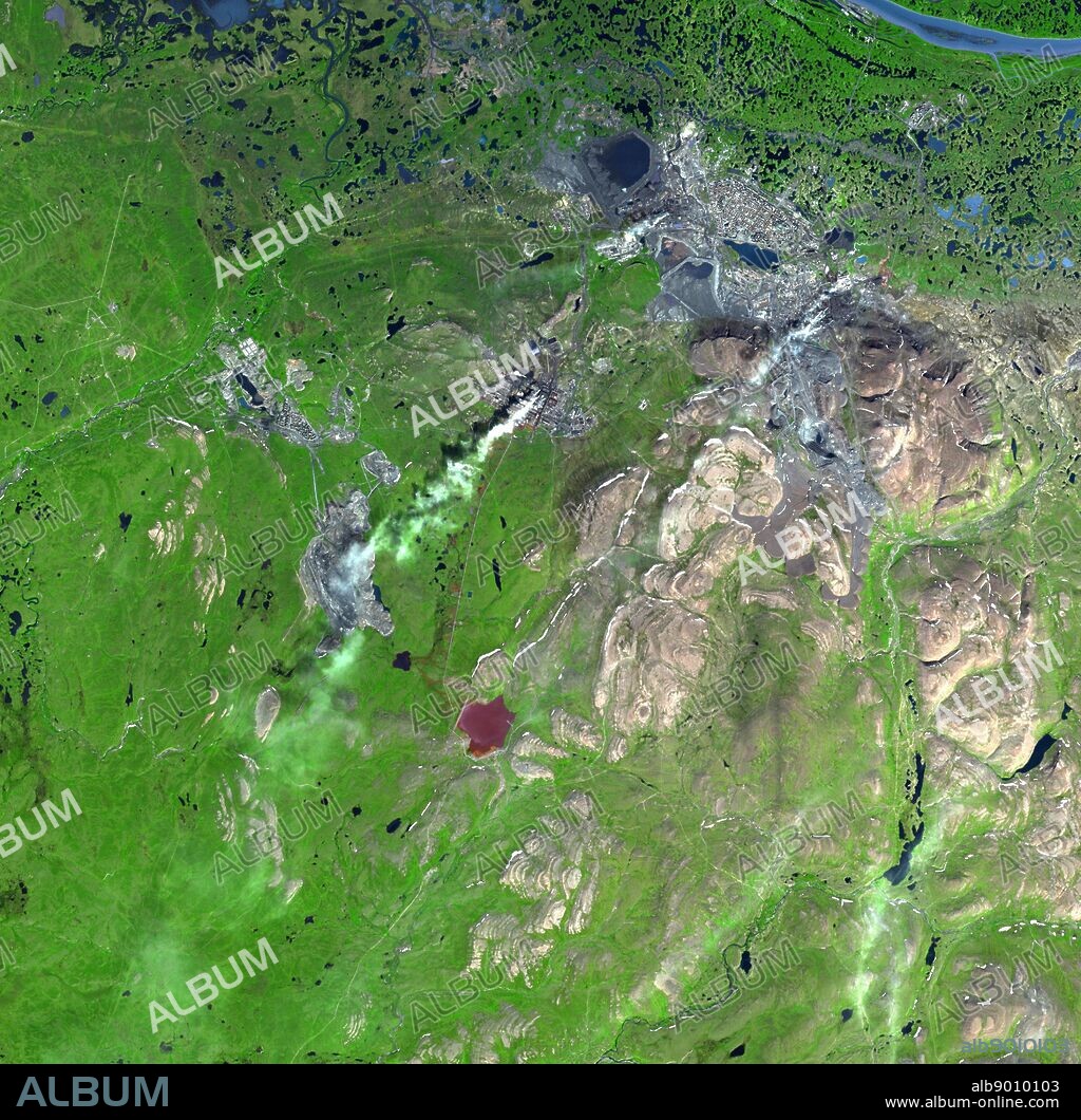 Norilsk is a major city in Krasnoyarsk Krai, Russia, and the northernmost city in Siberia. The city was founded in the 1930s as a settlement for the Norilsk mining-metallurgic complex, sitting near the largest nickel-copper-palladium deposits on Earth. Mining and smelting of nickel, copper, cobalt, platinum, palladium are the major industries. The nickel ore is smelted on site at Norilsk. The smelting is directly responsible for severe pollution, generally acid rain and smog. By some estimates, 1 per cent of the entire global emissions of sulphur dioxide comes from this one city. Heavy metal pollution near Norilsk is so severe that it is now economically feasible to mine the soil, which has been polluted so severely that it has economic grades of platinum and palladium. 2000.