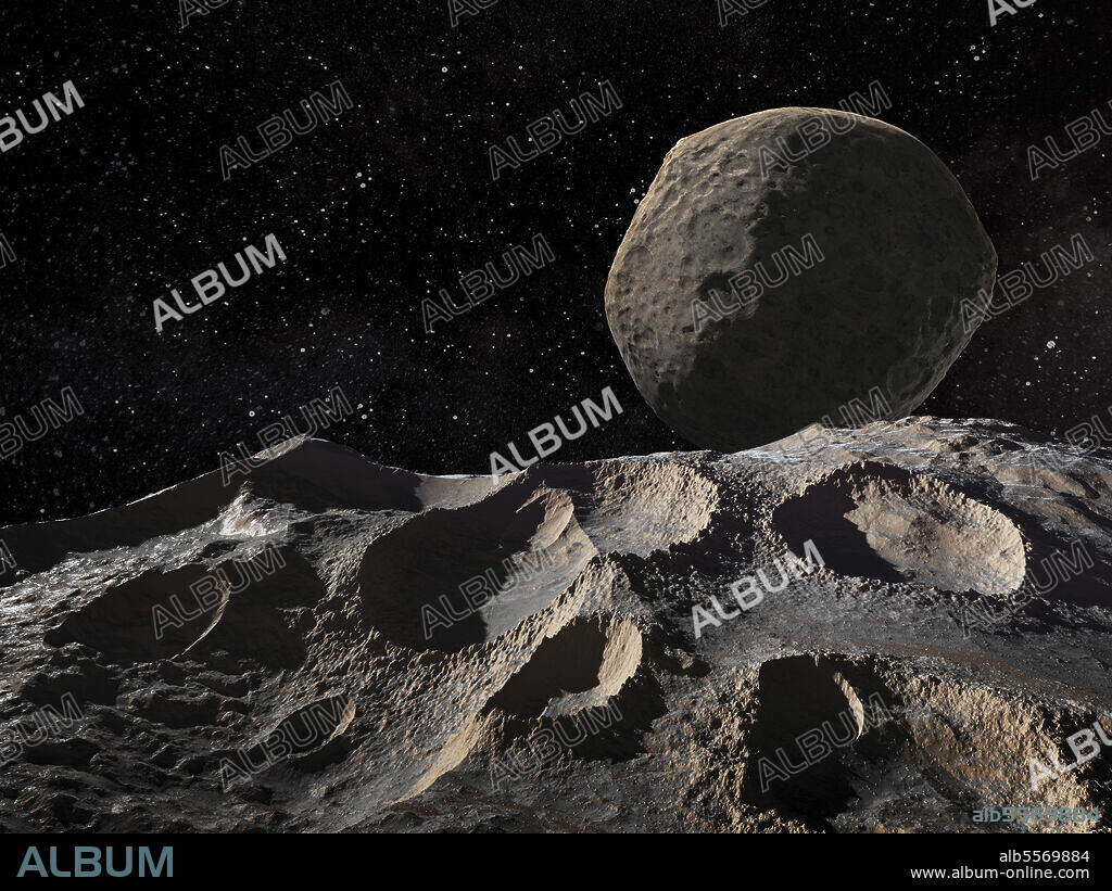 The asteroid Ida, viewed at close range by the Galileo spacecraft, was discovered to have a tiny moon, Dactyl, orbiting it. In this view Dactyl hovers in the sky of Ida.
