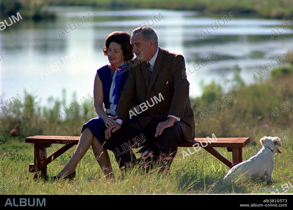Lady Bird Johnson, President Johnson, and Yuki sitting near the Pedernales River, Texas. Dated September 30, 1967. Claudia Alta Taylor "Lady Bird" Johnson (December 22, 1912 - July 11, 2007) was the wife of Lyndon B. Johnson and First Lady of the United States during his presidency from 1963 to 1969. As First Lady, she broke new ground by interacting directly with Congress, employing her own press secretary, and making a solo electioneering tour. Lyndon Baines Johnson (August 27, 1908 - January 22, 1973) was the 36th President of the United States (1963-1969). He served in all four elected federal offices of the United States: Representative, Senator, Vice President, and President. He was responsible for designing the "Great Society" legislation that included laws that upheld civil rights, public broadcasting, Medicare, Medicaid, environmental protection, aid to education, and his "War on Poverty.".