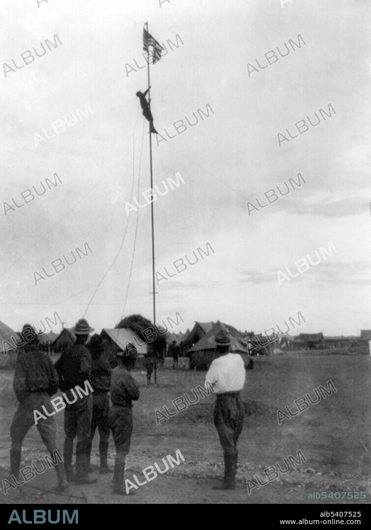 Soldier climbing flagpole to loosen flag which has become entangled in pulley, Mexico. The Pancho Villa Expedition was a military operation conducted by the US Army against the forces of Mexican revolutionary Pancho Villa from March 1916 - February 1917, during the Mexican Revolution of 1910-20. The expedition was launched in retaliation for Villa's attack on the town of Columbus, New Mexico. Despite successfully locating and defeating the main body of Villa's command, responsible for the raid on Columbus, US forces were unable to achieve Wilson's stated main objective of preventing Villa's escape.