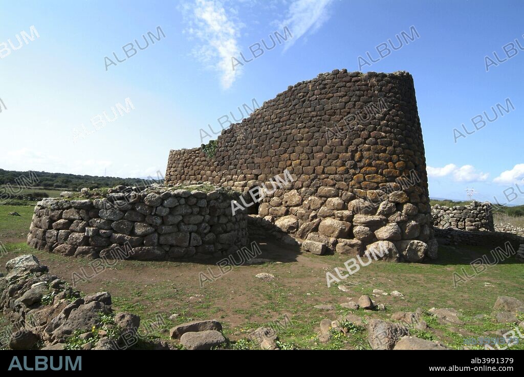 Nuraghe Tholos and Nuraghe Losa, Sardinia, Italy. The island of Sardinia features unique megalithic edifices known as Nuraghe. Most of them were built in the Bronze Age, between 1500 and 1800 BC. They are considered to be the best preserved megalithic structures in Europe. The use of the nuraghi has not been clearly determined: whether funerary monuments, ordinary dwelling, military strongholds, meeting halls or religious temples. Nuraghe Losa is one of the larger nuraghi in Sardinia. Around the nuraghe there are traces of a nuragic village and wall. The nucleus of the prehistoric structures is composed of a complex Tholos nuraghe, the top floor of which has fallen. On the southern side of the nuraghe is a round hut.