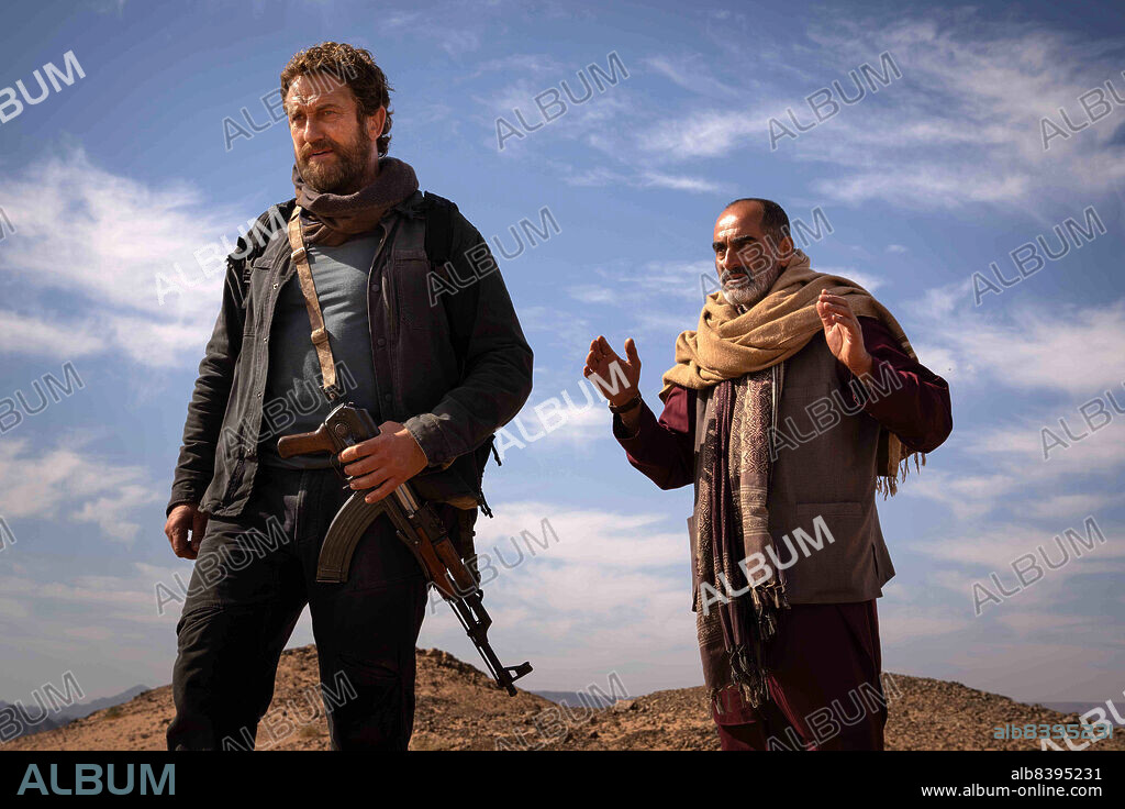 GERARD BUTLER and NAVID NEGAHBAN in KANDAHAR, 2023, directed by RIC ROMAN WAUGH. Copyright Thunder Road Pictures.
