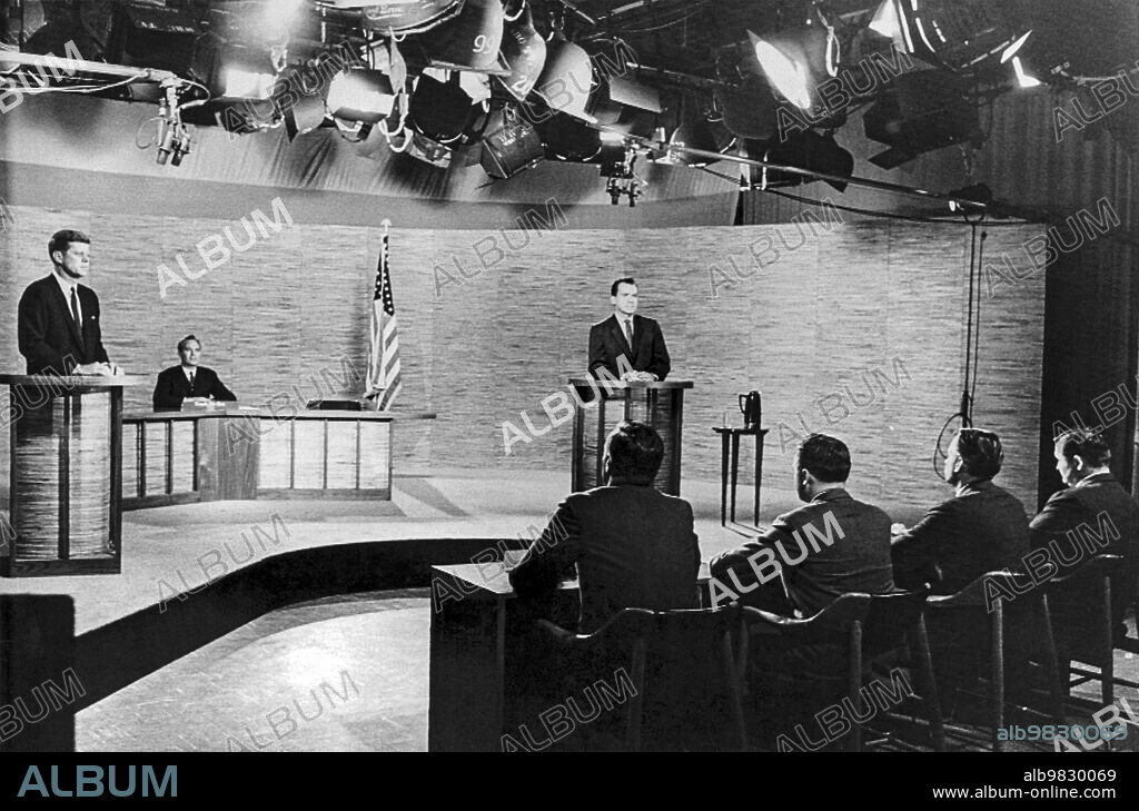 Washington DC, October 7, 1960, The set for the presidential campign debate between Senator John F. Kennedy, (L) and Vice-President Richard M Nixon, (R). Moderator Frank McGee of NBC is seated center behind them in the rear. The newsmen who asked the questions were (L-R) Hal Levy of Newsday, Alvin Speak of UPI, Edward Morgan of ABC, and Paul Niven of CBS.