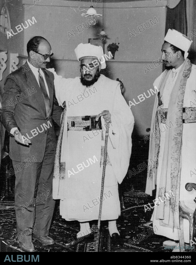 King Ahmed Receives Major SalemMajor Salah Salem, Egypt's minister of National guidance and of Sudan Affairs, left Cairo by air, July 6 for a six day visit to Yemen at the invitation of King Ahmed. Photo shows: Left to right in the state room of the Royal Palace: Major Salah Salem King Ahmed of Yemen and Emir Badr. March 14, 1954. (photo by Associated Press Photo).