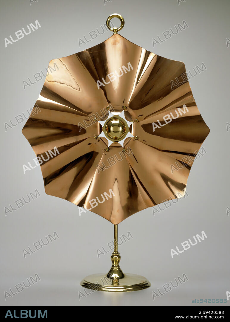 Fire screen, c. 1900, William Arthur Smith Benson, British, English, 18541924, 29 9/16 x 20 3/4 x 8 1/8 in. (75.09 x 52.71 x 20.64 cm), Copper, brass, England, 19th-20th century, This simple, elegant screen served as a shield from fireplace heat. William Arthur Smith Benson favored minimalism in metalwork and used machine production to achieve it. Here, petal-like sheets of rolled copper, bent slightly to create an octagonal design, are attached to a brass pole. The shape suggests a ships propellerfurther evidence of Bensons keen interest in machines.