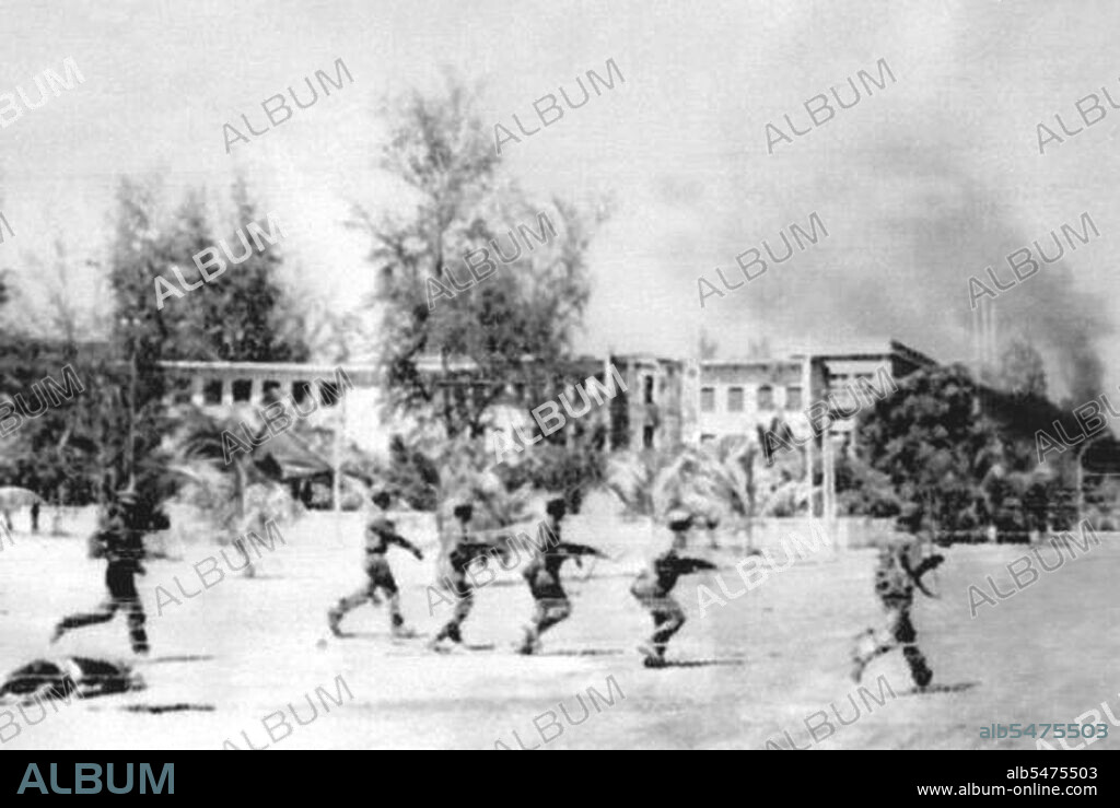 Rare image taken by a Vietnamese military photographer of Vietnamese soldiers advancing under fire into the heart of Phnom Penh. The depopulated city, inhabited only by Khmer Rouge leadership and forces, fell to the Vietnamese on January 7, 1979. The Khmer Rouge, or Communist Party of Kampuchea, ruled Cambodia from 1975 to 1979, led by Pol Pot, Nuon Chea, Ieng Sary, Son Sen and Khieu Samphan. It is remembered primarily for its brutality and policy of social engineering which resulted in millions of deaths. Its attempts at agricultural reform led to widespread famine, while its insistence on absolute self-sufficiency, even in the supply of medicine, led to the deaths of thousands from treatable diseases (such as malaria). Brutal and arbitrary executions and torture carried out by its cadres against perceived subversive elements, or during purges of its own ranks between 1976 and 1978, are considered to have constituted a genocide. Several former Khmer Rouge cadres are currently on trial for war crimes in Phnom Penh.