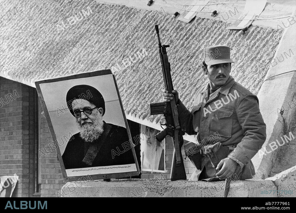Iranian Revolution / Tabriz / Kazem Shariatmadari against Ayatollah Khomeini. In Tabriz (East Azerbaijan in Iran) followers of the Ayatollah Mohammad Kazem Shariatmadari climb the roof of the TV building. They present a portrait of Ayatollah Kazem Shariatmadari. Photo, 09.12.1979.