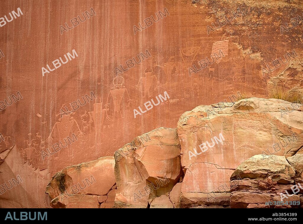 Petroglyphs etched in sandstone, symbols, mural paintings, depicting Fremont, Anasazi, Navajo and Anglo-Saxon cultures, prehistoric and historic rock art, Capitol Reef National Park, Utah, Southwestern USA.