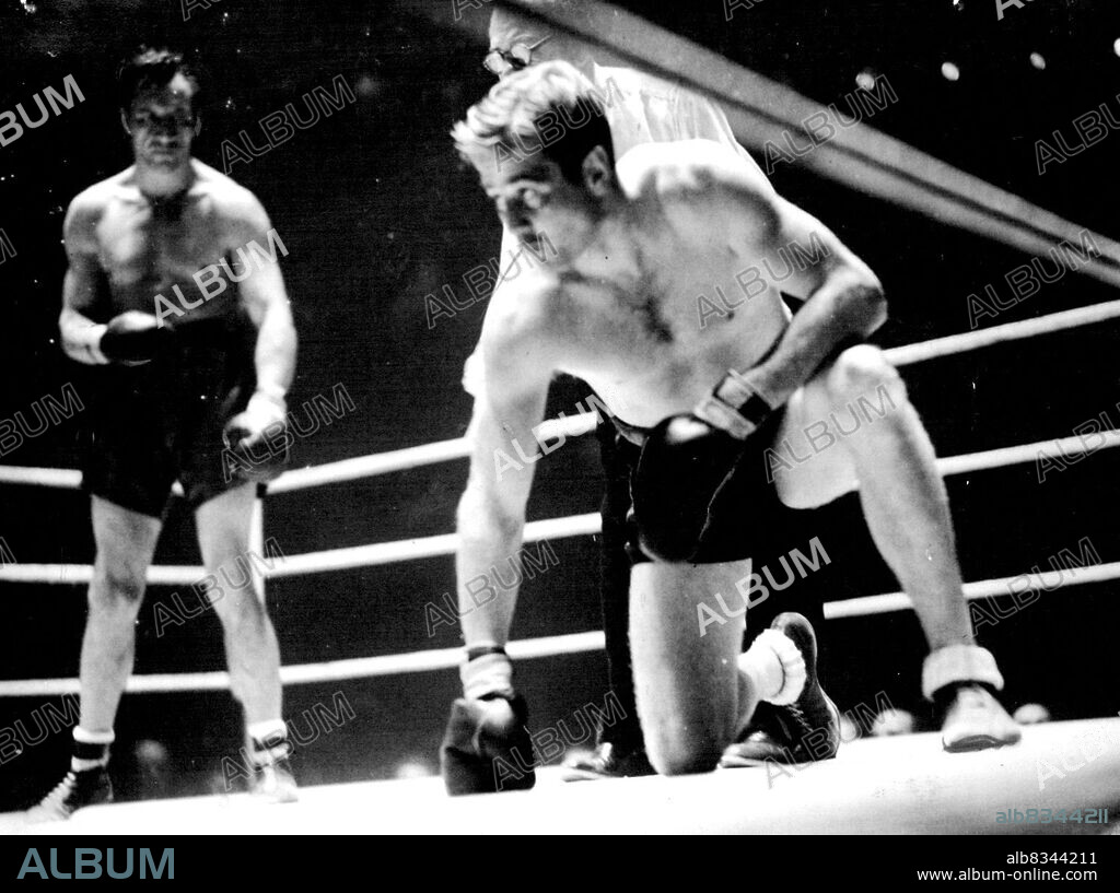 Swedish Boxer Loses At Albert Hall -- Olle Tandberg taking a count of nine in the second round; Phillips is ***** back by the ropes.Eddie Phillips, former British champion proved too good for Olle Tandberg at the Albert Hall last night - Phillips beat the Swedish champion on points. Phillips is 8 years older than Tandberg and has not fought for 6 ear but he twice dropped Tandberg and punched him round the ring in the last round. September 26, 1945.