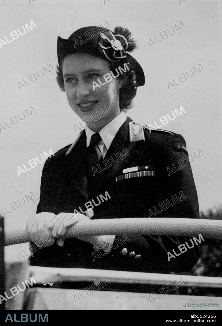 Inspected By Their Commandant, The Princess -- Princess Margaret, wearing the uniform of Commandant-in-Chief, St. John Ambulance Bridge Cadets, stands in a jeep as she inspects the 3,000 cadets who had come from all parts of the world to attend this rally at Worcester race course. The Princess also presented gallantry awards. July 26, 1952. (Photo by Plant News Ltd.).