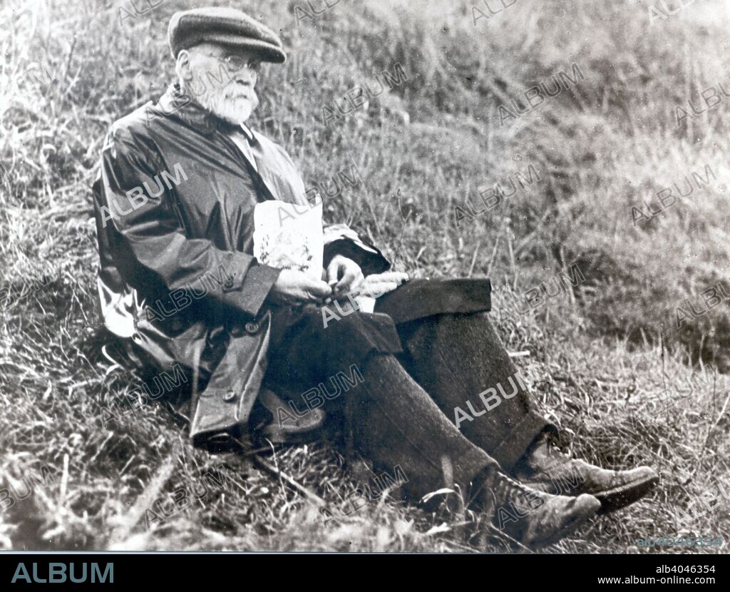 Joseph Rowntree eating lunch on grass at Scarborough, North Yorkshire, 1918.