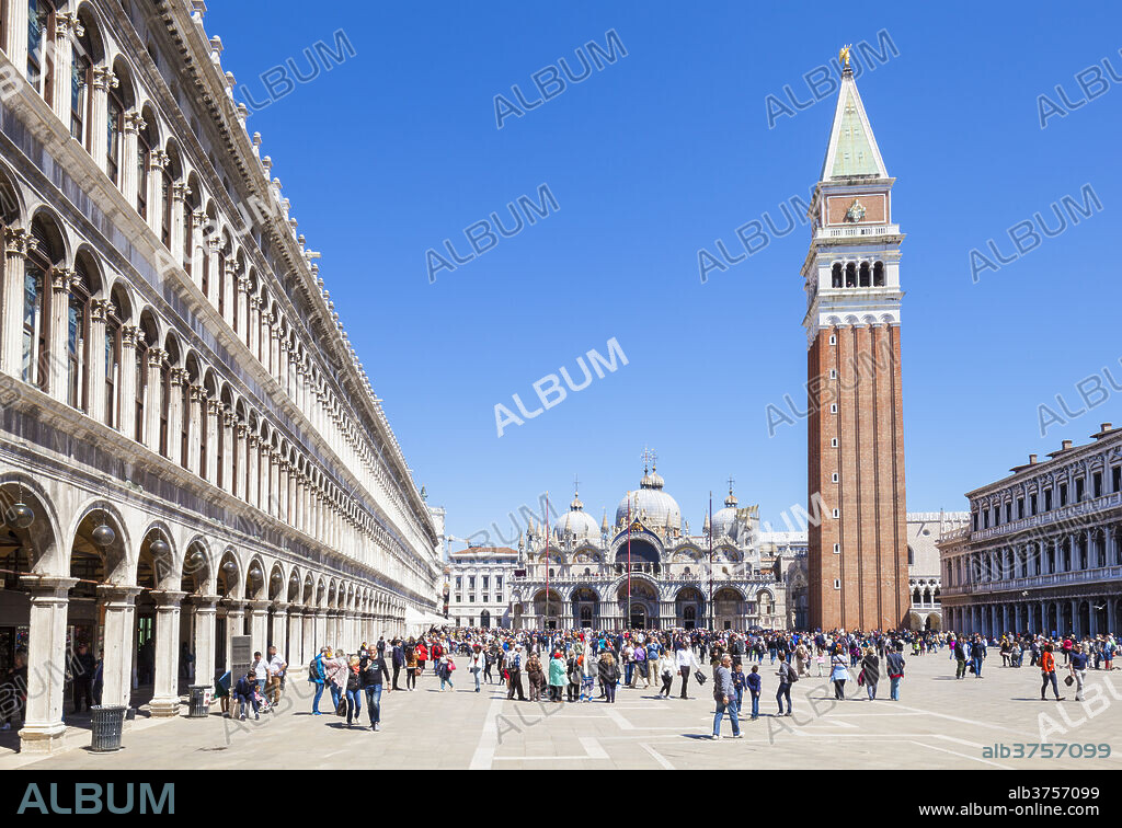Campanile tower, Piazza San Marco (St. Marks Square) with tourists and Basilica di San Marco, Venice, UNESCO World Heritage Site, Veneto, Italy, Europe.
