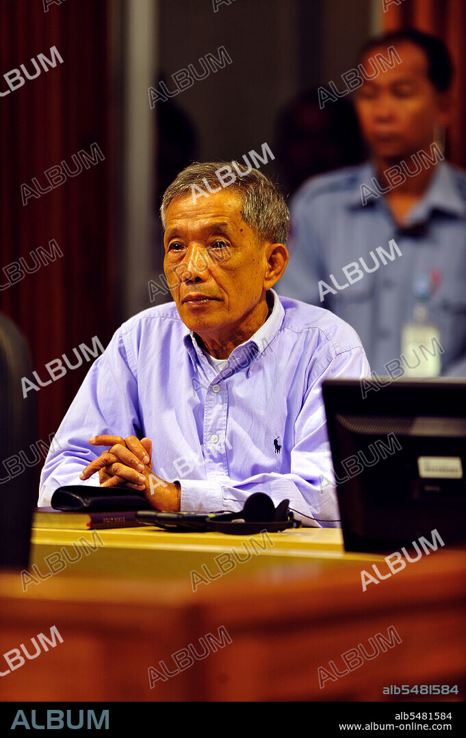 Kang Kek Iew or Kaing Kek Iev, also romanized as Kaing Guek Eav, nom de guerre Comrade Duch or Deuch; or Hang Pin, (born 17 November 1942) is a former leader in the Khmer Rouge communist movement, which ruled Democratic Kampuchea from 1975 to 1979. He is best known for heading the Khmer Rouge special branch and running the infamous Tuol Sleng (S-21) prison camp in Phnom Penh. The first Khmer Rouge leader to be tried by the Extraordinary Chambers in the Courts of Cambodia for the crimes of the regime, he was convicted of crimes against humanity, murder, and torture for his role in the Cambodian Holocaust and sentenced to 35 years' imprisonment. Photo by the Extraordinary Chambers in the Courts of Cambodia for the Prosecution of Crimes Committed During the Period of Democratic Kampuchea, commonly known as the Cambodia Tribunal.
