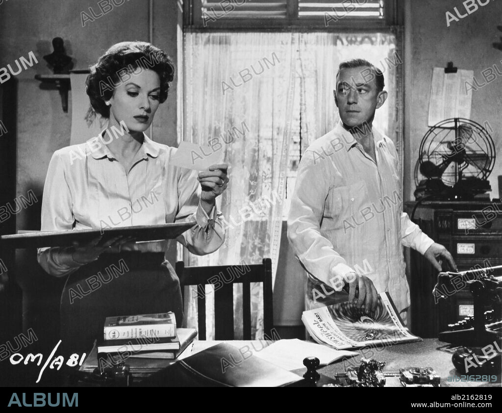 ALEC GUINNESS and MAUREEN O'HARA in OUR MAN IN HAVANA, 1959, directed by CAROL REED. Copyright COLUMBIA PICTURES.
