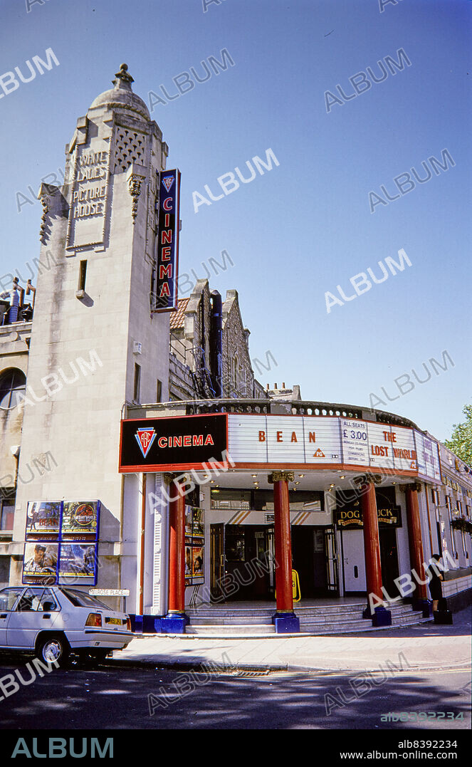 NORMAN WALLEY. ABC Cinema, Whiteladies Road, Clifton, City of Bristol, Aug 1997-Sep 1997. The corner entrance and tower of the ABC Cinema, formerly the Whiteladies Picture House, from the south. The Whiteladies Picture House opened in 1921. The building incorporates an earlier terraced house, and formerly also included a ballroom and restaurant which were later converted into a public house and offices. The cinema was renamed the ABC, Cannon, and then MGM Cinema, before reverting to the ABC name in the 1990s. The cinema was briefly used as a gym in the early 21st century, before reopening as the Everyman Cinema in 2016.