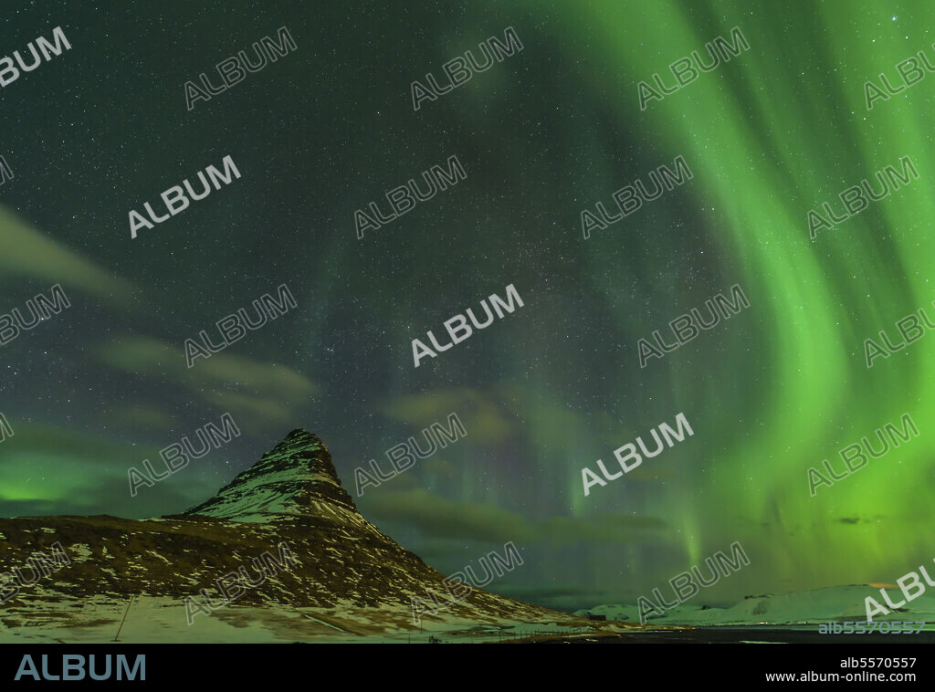 Spectacular northern lights over Mount Kirkjufell in Iceland.