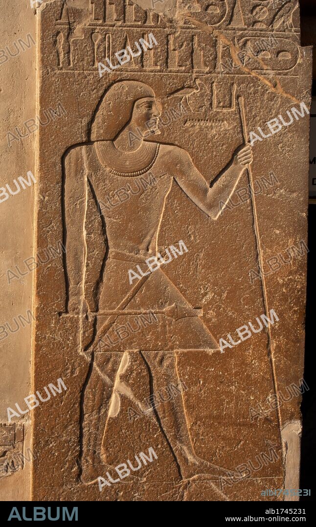 Mastaba of Kagemni (2350 BC). Chief Justice and vizier of the Pharaoh Teti. Relief at the entrance depicting Kagemni with the baton and scepter. Old Kingdom. Saqqara. Egypt.