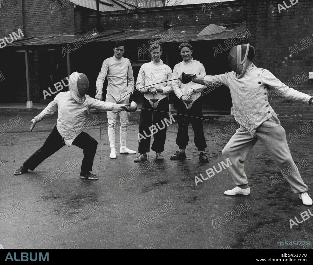 Australia's pentathlon representative at Helsinki Olympic Games Forbes Carlile, will meet one or more of these five British pentothlon athletes here practicing fencing at a British Army school as part of their training. April 03, 1952.