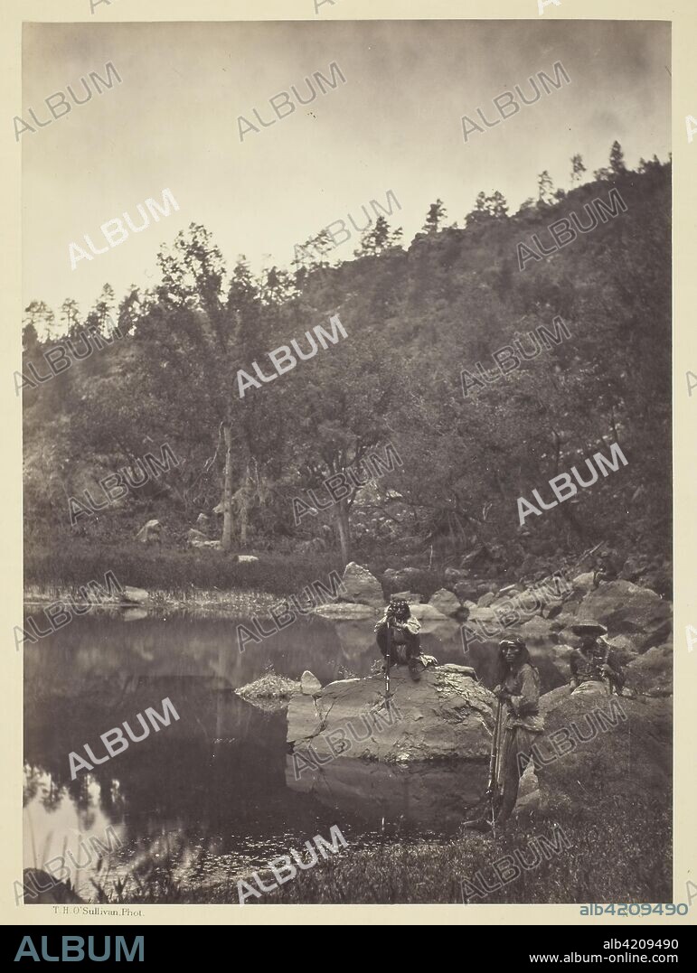 View on Apache Lake, Sierra Blanca Range, Arizona, Two Apache Scouts in the Foreground. Timothy O'Sullivan; American, born Ireland, 1840-1882. Date: 1873. Dimensions: 27.7 x 20.3 cm (image/paper); 49.9 x 39.4 cm (mount). Albumen print, from the album "Geographical & Geological Explorations & Surveys West of the 100th Meridian," vol. 1. Origin: United States.