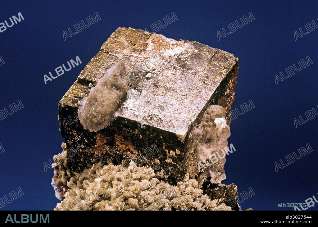 Siderite, iron carbonate, is a member of the calcite group of minerals. These are all carbonates with similar crystal structures. While calcite (calcium carbonate) is colorless or white, siderite is brown due to the presence of iron. Siderite is a common mineral in the oxidized zones of ore deposits throughout the world. Excellent rhomb-shaped crystals of siderite can be found in many localities, but one of the most notable is the quarry at Mt. Ste. Hilaire, Quebec, a place that has produced one of the largest number of mineral species of any single locality on earth.