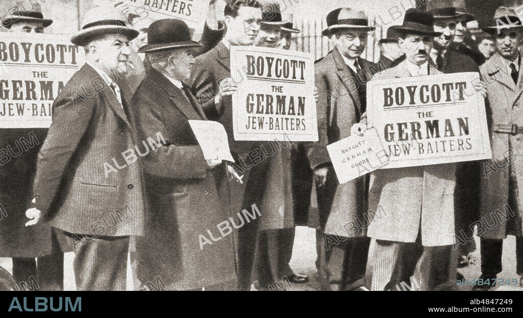 A group of Jews protesting against Hitler's anti-Jewish doctrine assembled in Hyde Park, London, England in 1933 holding signs which read 'Boycott the German Jew- Baiters'.  From The Pageant of the Century, published 1934.