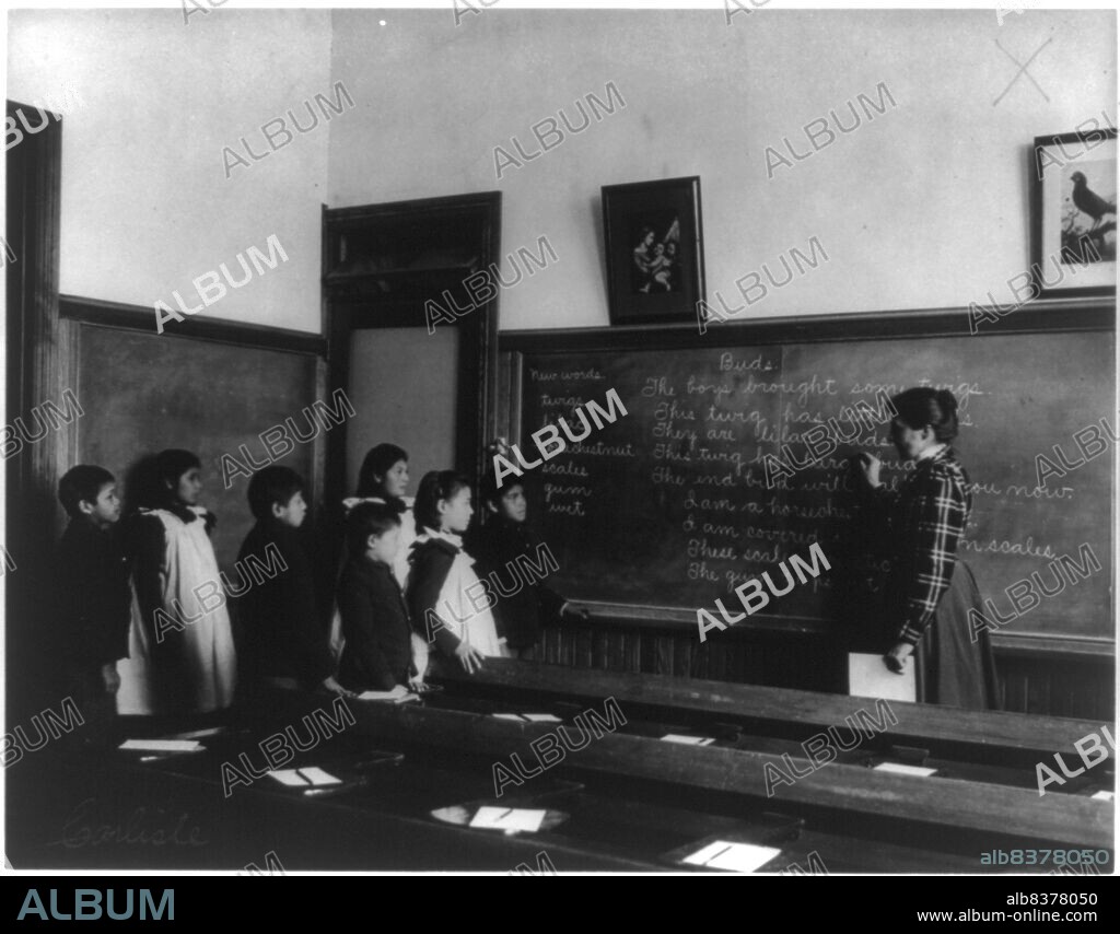 FRANCES BENJAMIN JOHNSTON. Carlisle Indian School, Carlisle, Pa. Classroom scene, 1901.