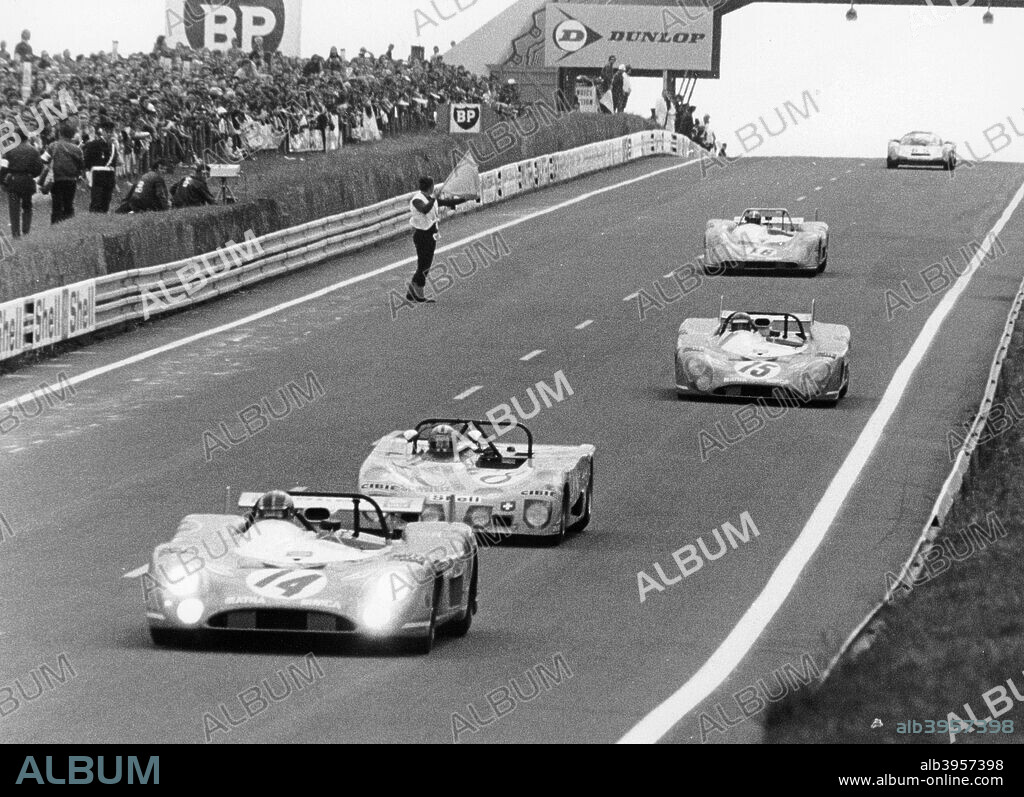 Matra-Simca 670 leading a Lola T280, Le Mans, France, 1972. The Matra of Francois Cevert and Howden Ganley leads the Lola of  Joakim Bonnier, Gerard Larrousse and Gijs van Lennep down the hill from the Dunlop Bridge. In third place is the Matra of Henri Pescarolo and Graham Hill, the eventual winners ahead of Cevert and Ganley. The Lola was involved in a crash later in the race, in which Bonnier was killed.