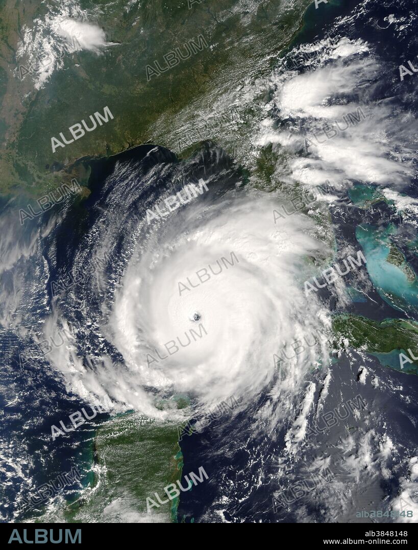 Rita was building into an extremely dangerous Category 5 hurricane when the ' on NASA's Terra satellite captured this image at 12:10 p.m., U.S. Eastern time on September 21, 2005. The storm bears the markings of a powerful hurricane: it is compact and circular, with an open eye through which the deep blue waters of the Gulf of Mexico are visible. At the time this image was acquired, Rita had winds of 220 kilometers per hour (140 miles per hour) with gusts to 270 kph (170 mph). Within a few hours, the storm intensified to a Category 5 hurricane with sustained winds of 265 kph (165 mph). Rita is the second Category 5 storm of the 2005 Atlantic hurricane season. The first was Hurricane Katrina, which devastated much of the Mississippi, Louisiana, and Alabama shoreline when it came ashore on August 29. Rita is expected to weaken slightly before coming ashore over the Texas or Louisiana coastline on September 23 or 24 as a major hurricane (Category 3 or higher). In this photo-like image, the Gulf Coast of the United States frames the open water to the north, while the Yucatan Peninsula is visible to the south. MODIS detected several fires, marked with red dots, burning in the southeastern United States. The fires are probably agricultural fires.