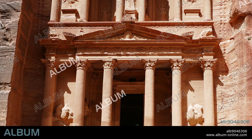 Al-Khazneh (The Treasury) a temple in the ancient Nabatean Kingdom city of Petra, Jordan. The structure was carved out of a sandstone rock face and is believed to have been the mausoleum of the Nabatean King Aretas IV in the 1st century AD. It is one of the most popular tourist attractions in both Jordan and the region. In 1812, the city of Petra and Al-Khazneh was rediscovered by Swiss explorer Johann Ludwig Burckhardt.