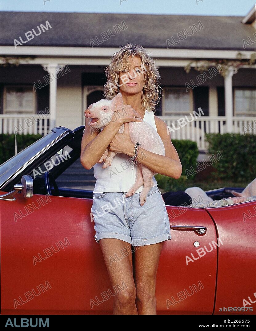 FARRAH FAWCETT (Feb. 2, 1947 - Jun. 25, 2009), 62, actress, anal cancer victim. Pop culture figure whose hairstyle was emulated by millions of young women and whose red swimsuit pinup 70's poster sales set records, making her an all time sex symbol. Fawcett was best know for her flowing blonde tresses and glistening smile in her iconic role as Jill Munroe in TV Series 'Charlie's Angel's' 1976 - 1980. Won Emmy for 'The Burning Bed' where she played a battered wife. Survived by her son with actor Ryan O'Neal (Redmond b. Jan. 30,1985- ). PICTURED - Farrah in 1999 during filming of 'Silk Hope' TV movie. File Photo Exact Date Unknown. 26/06/2009