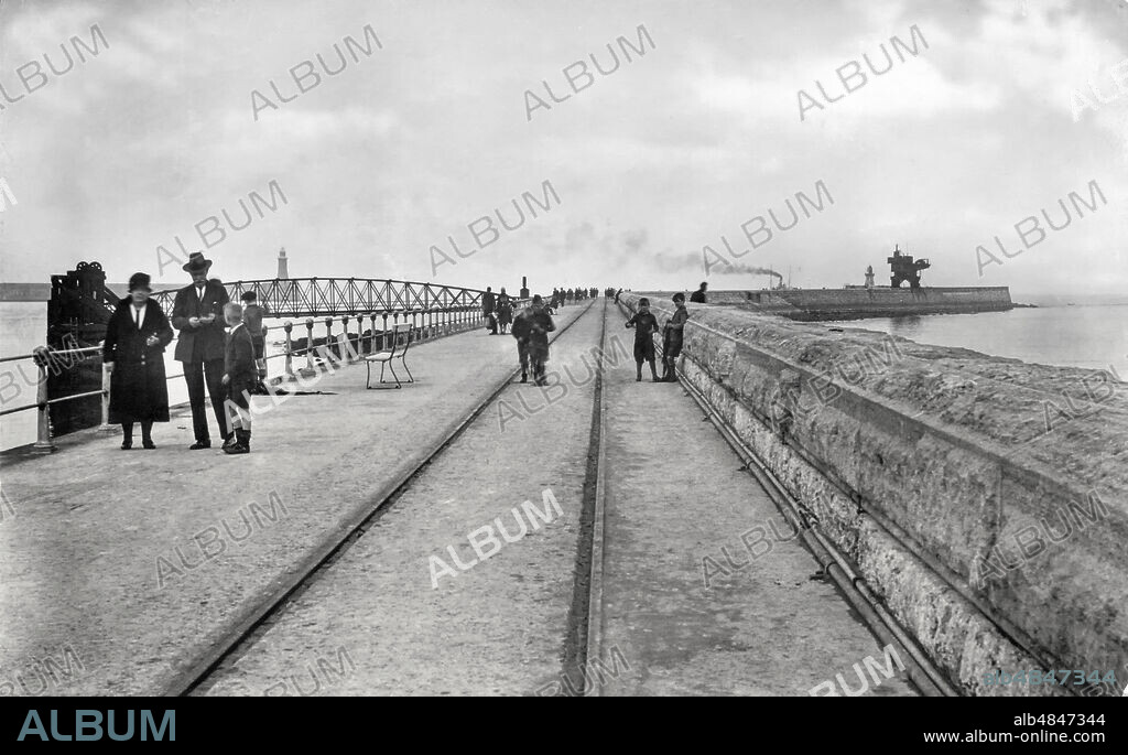 Postcard circa 1900, Victorian/Edwardian, social history. South Shields pier, black and white postcard; South Shields,Tyne and Wear, England.
