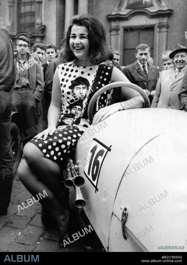 Popular Big Beat 'Mephisto' Singer Pruneova With 1912 Bugatti In 1964. She Is Wearing A Dress With Likenesses Of The Beatles On It. (Photo by: Sovfoto/UIG via Getty Images).