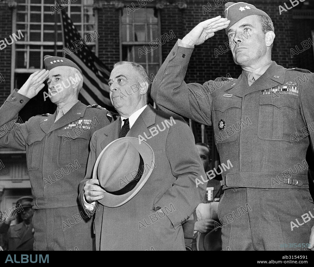 Philadelphia, Pennsylvania:  June 6, 1945 L-R: General Omar Bradley, Philadelphia Mayor Samuel, and Maj. General McAuliffe salute as the national anthem is played during their visit to Independence Hall.
