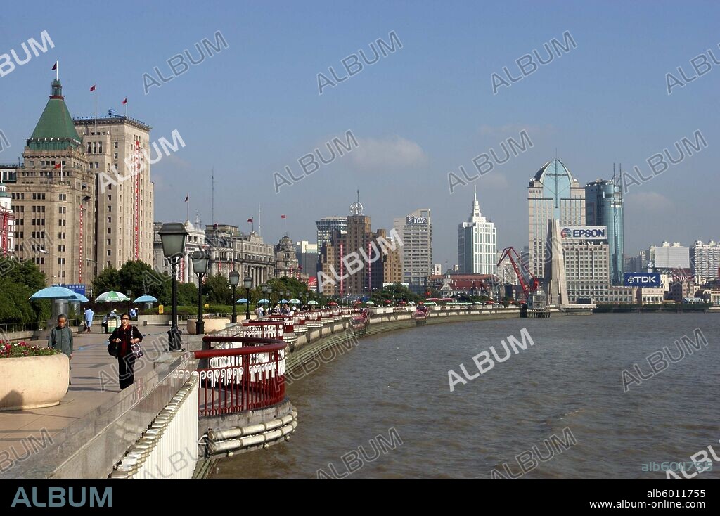 CHINA Shanghai The Bund aka Zhong Shan Road. View along the promenade that runs along the Huangpu River with the city skyline in the distance.