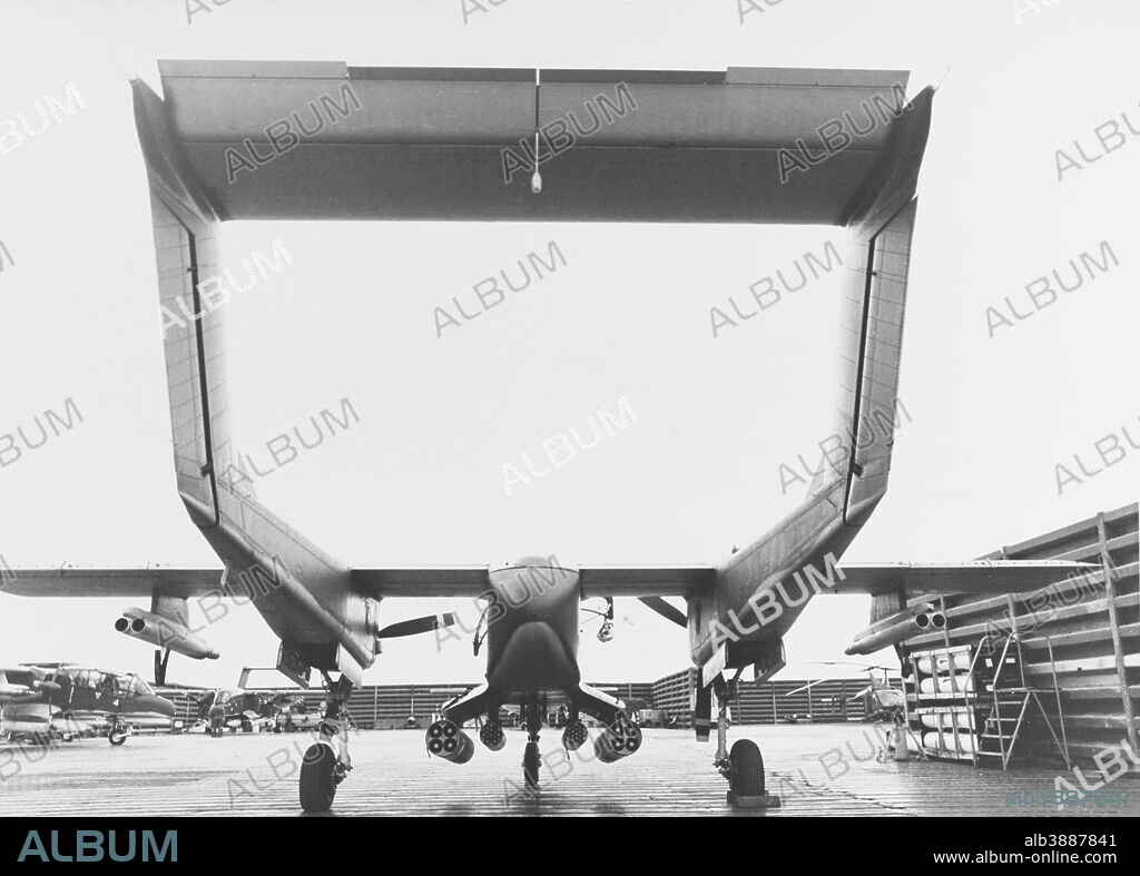 June 1969 - A North American Rockwell OV-10A Bronco reconnaissance aircraft of U.S. Navy Light Attack Squadron Four (VAL-4) parked in a revetment at Binh Thuy Air Base, Republic of Vietnam, armed and ready for its next mission. This plane carries twelve Zuni 5-inch Folding-Fin Aircraft Rockets (FFAR) in two and four-rocket pods, plus two pods each holding seven 2.75-inch FFARs. Other OV-10As and a U.S. Air Force Kaman H-43 helicopter are in the background.