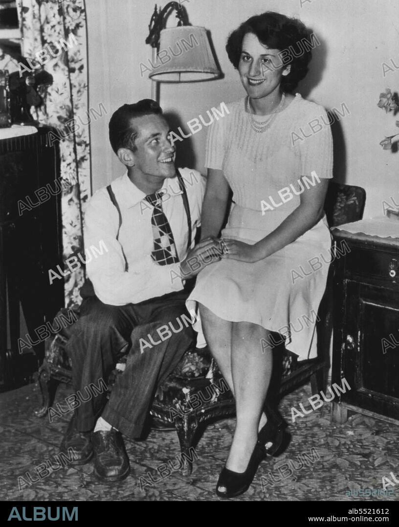 Finishes With First Fiance - Sheila Hynes, 19-year-old English girl, and Carl Wesch, 23, talk over wedding plans in home of Wesch's mother here yesterday. Sheila said that she finally made up her mind to marry Carl despite the fact that she came to the United States from England last week to marry his pal. Harold Conley, to whom she became engaged through correspondence. She and Carl met in England when he was in service there and became engaged. Engagement was later broken. August 21, 1947. (Photo by AP Wirephoto).