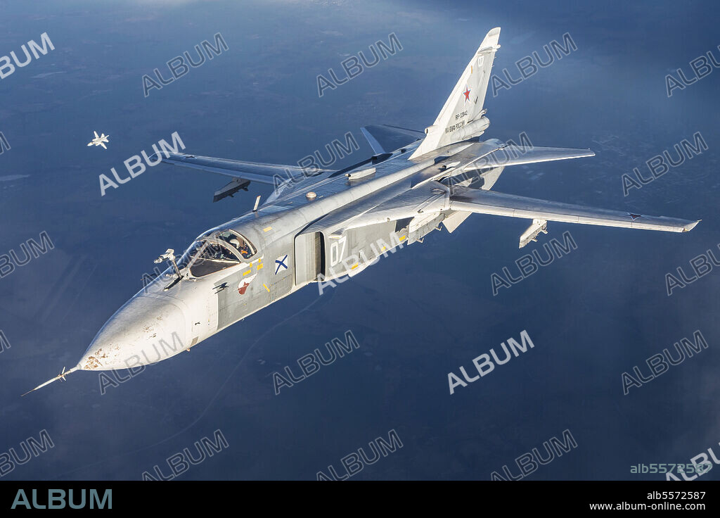 Sukhoi Su-24M frontline bomber plane of the Russian Navy flying in mid-air, Kaliningrad Region, Russia.