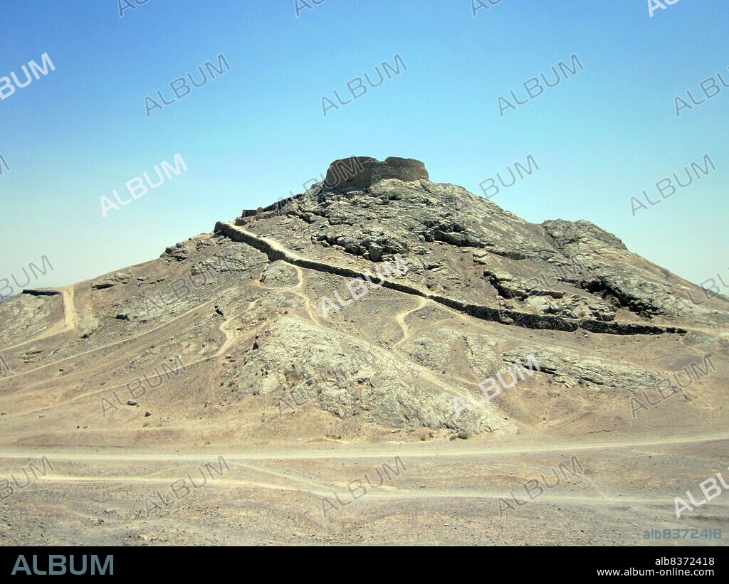 A Tower of Silence or Dakhma is a circular, raised structure used by Zoroastrians for exposure of the dead. There is no standard technical name for such a construction. The common <i>dakhma</i> or <i>dokhma</i> (from Middle Persian <i>dakhmag</i>) originally denoted any place for the dead. Similarly, in the medieval texts of Zoroastrian tradition, the word astodan appears, but today denotes an ossuary.<br/><br/>. In the Iranian provinces of Yazd and Kerman, the technical term is <i>deme</i> or <i>dema</i>. In India, the term <i>doongerwadi</i> came into use after a tower was constructed on a hill of that name. The word <i>dagdah</i> appears in the texts of both India and Iran but, in 20th century India, signified the lowest grade of temple fire (cf. Fire temple). The term 'Tower of Silence' is a neologism attributed to one Robert Murphy, who, in 1832, was a translator of the British colonial government in India.