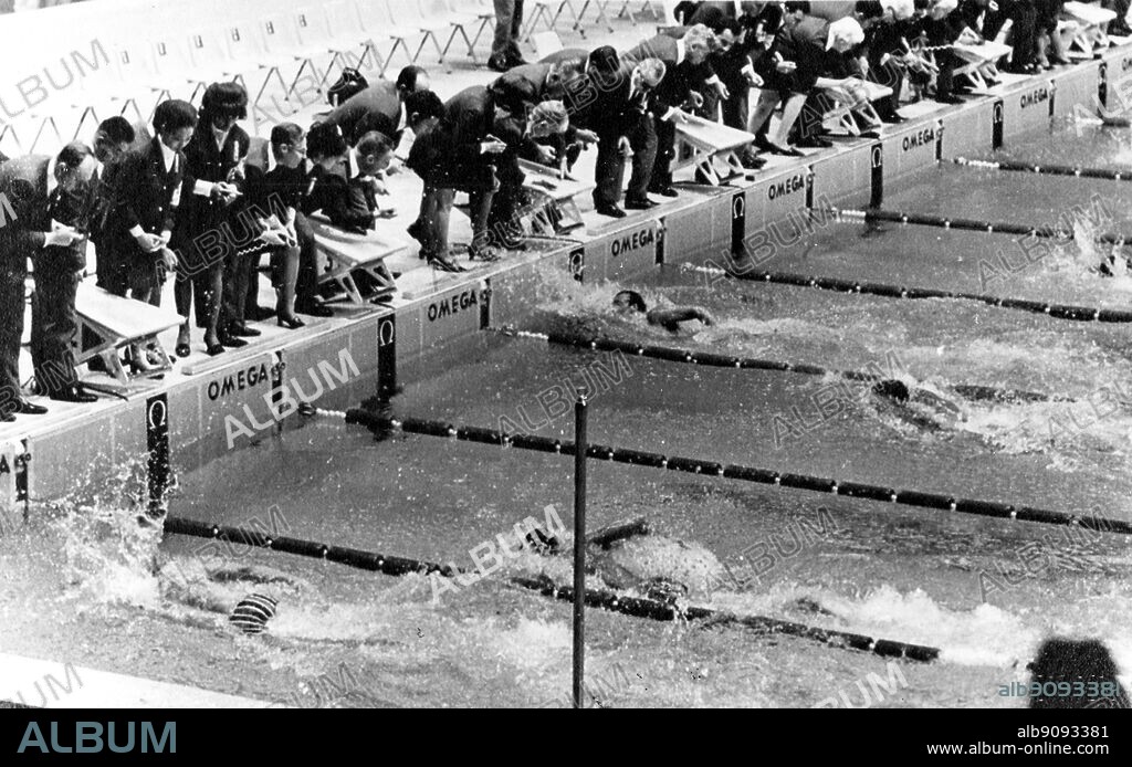 Mexico City Olympics 1968: Australia's 18 years old, Mike Wenden (4th lane from left) hits the pool wall in 52.2 seconds to break the world record for the 100 metres world record freestyle swim. In the first lane is Ken Walsh of the USA, former record holder and he took silver medal. In the second lane is Leonid Ilichev of Russia, fifth and in the third lane is Luis Nicolao of Argentina.