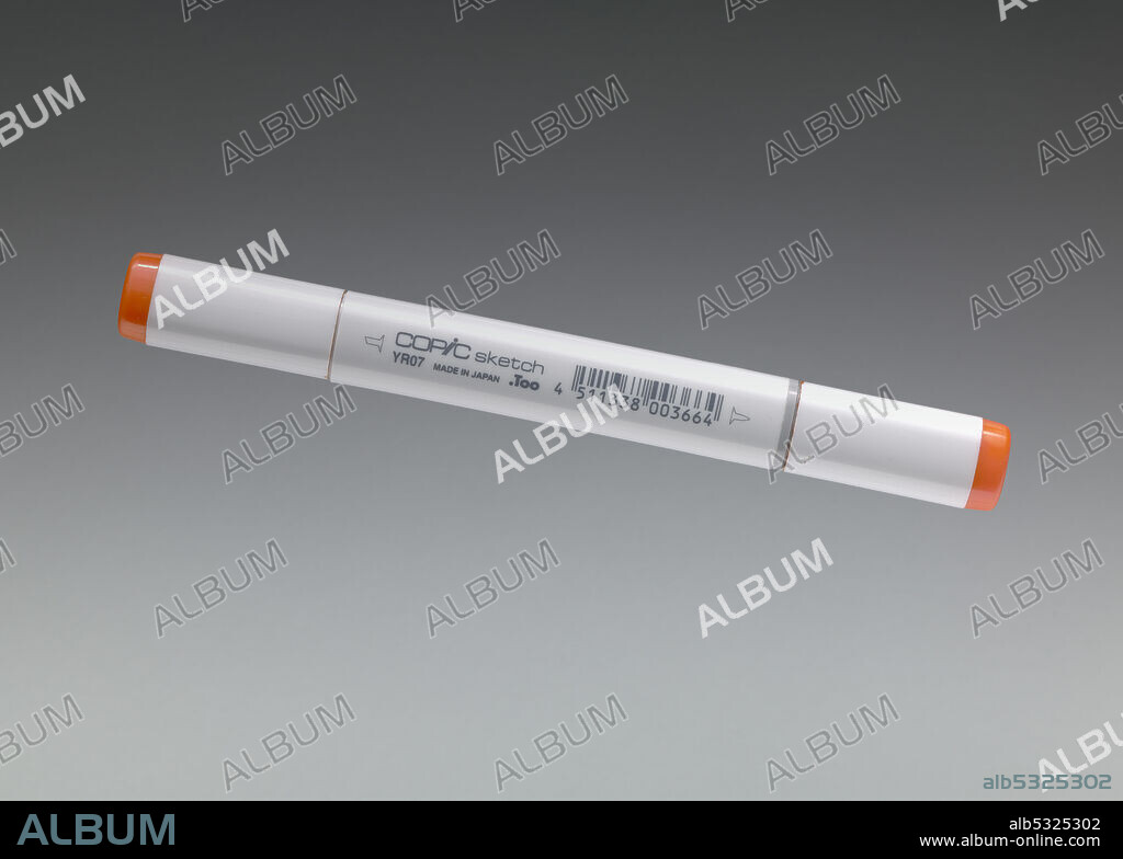 TOO CORPORATION. Orange Copic sketch marker used by African-American architect Michael Marshall. The marker (.5a) has two (2) caps, one on each end of the pen. One marker tip is angled (.5b) and the other is pointed (.5c). Each cap is grey with an orange top. At the top of each cap is white printed text [YR07 / Cadmium / Orange]. The body of the marker is grey with black text. The text has the pen trademark for Copic sketch, manufacturer information, and a barcode. The reverse is blank.