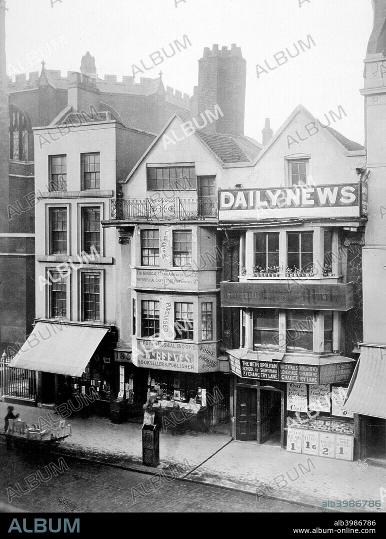 17th-century houses (now demolished) in Fleet Street, London, 1884. They accommodate a fishmongers and a music bookshop. The Daily News and Liverpool Mail advertise above. The octagonal nave of St Dunstan in the West can be seen behind.