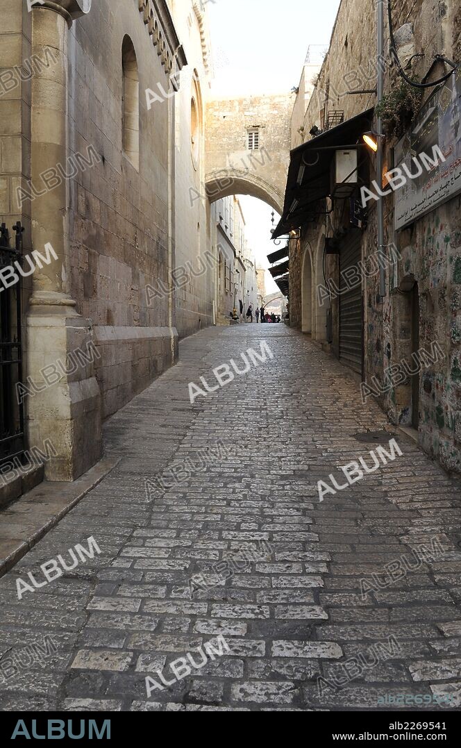 Israel. Jerusalem. Via Dolorosa. Street of Old City, which traditionally Jesus walked carrying the cross, way to his crucifixion. At background, the Arch of Ecce Homo.