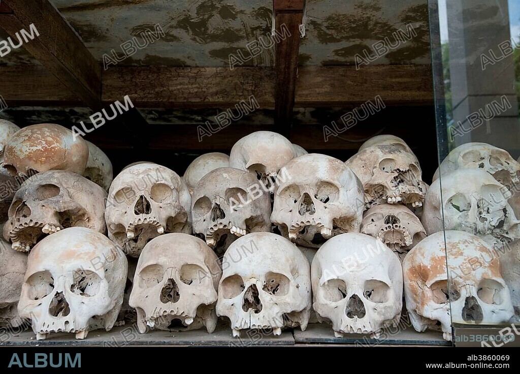 Skulls and bones in the Memorial Stupa to the prisoners murdered by the Communist or Maoist Khmer Rouge in Choeung Ek, Killing Fields, Phnom Penh, Cambodia, Asia.