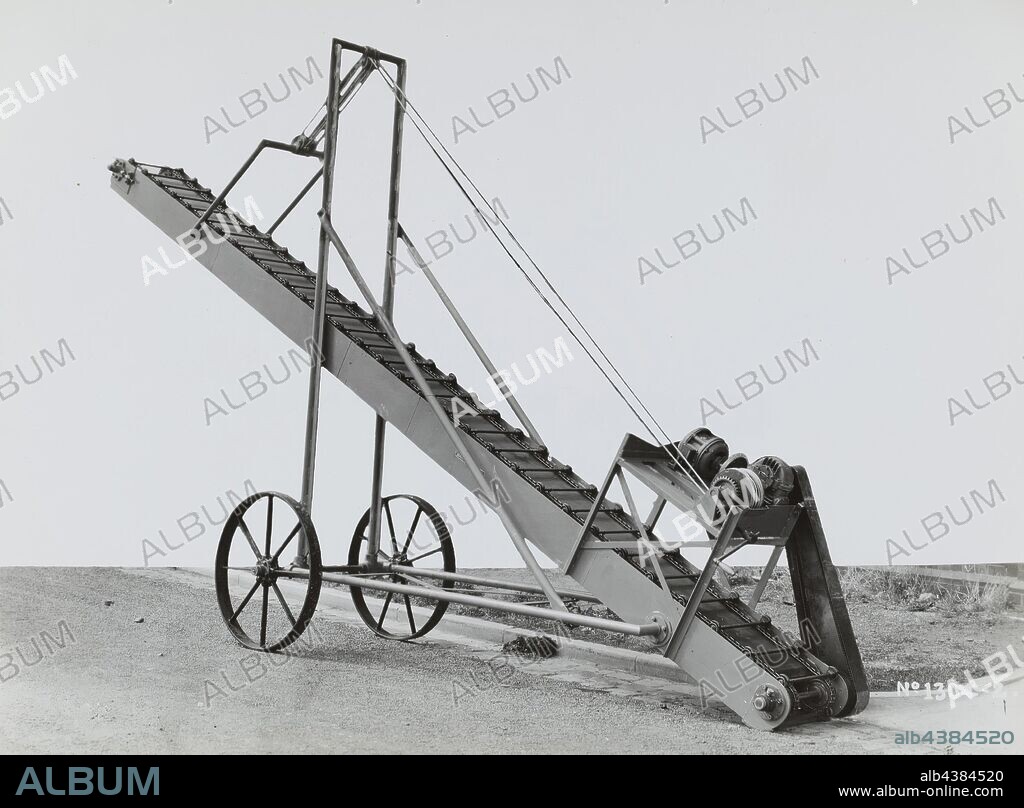 Photograph - Schumacher Mill Furnishing Works, Elevating Beam Conveyor-Elevator, Port Melbourne, Victoria, 1945, Black and white promotional image of a portable elevating beam conveyor-elevator. It is part of a collection of photographs and marked printer's copy used in the preparation of trade literature promoting products manufactured by the Schumacher Mill Furnishing Works Pty Ltd. The items were originally housed in a wooden filing drawer.